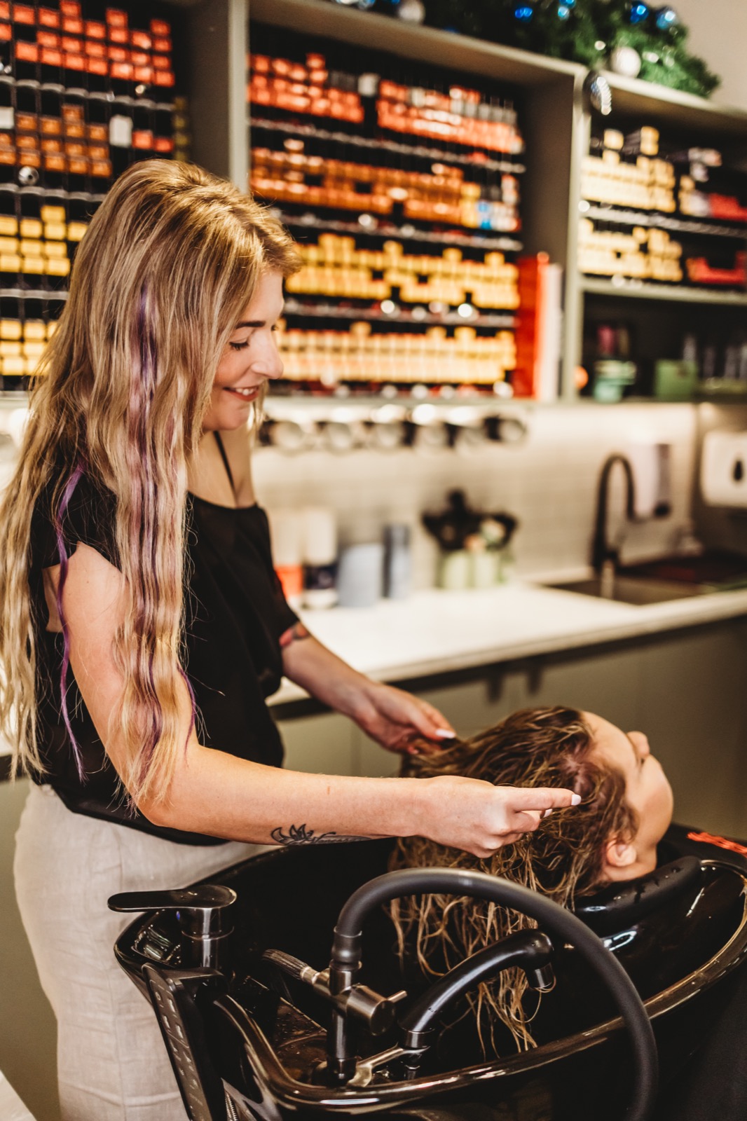 Hair Avenue stylist giving a relaxing shampoo and scalp massage at a basin