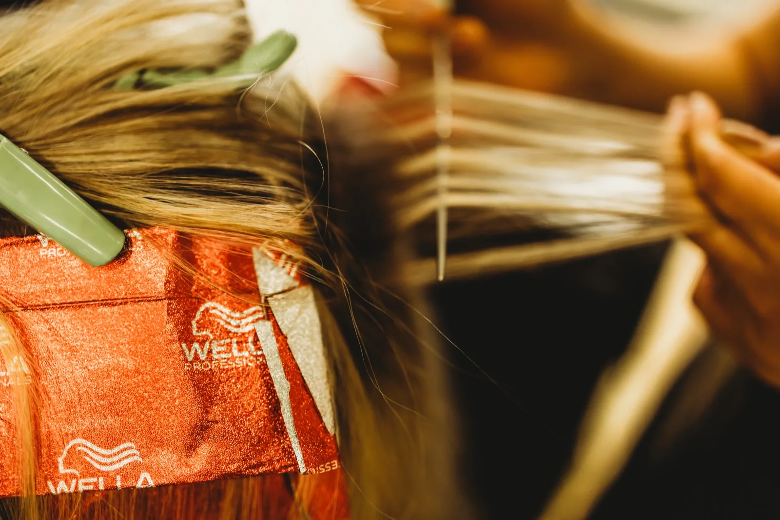 Hand-woven foils being placed through a blonde client's hair at Hair Avenue Braddon